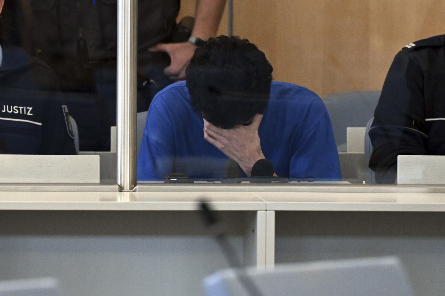 Suspect in fatal knife attack at German festival admits killings as trial starts
