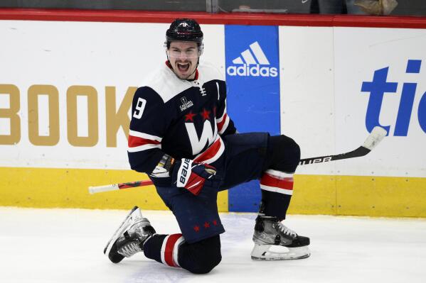 Washington Capitals defenseman Dmitry Orlov (9) celebrates after his goal during overtime of an NHL hockey game against the Detroit Red Wings, Monday, Dec. 19, 2022, in Washington. (AP Photo/Nick Wass)