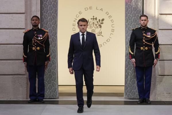 French President Emmanuel Macron arrives to hold a press conference at the Elysee Palace, in Paris, Friday, June 13, 2025.. (AP Photo/Michel Euler, Pool)