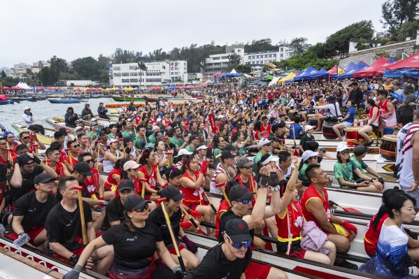 Competitors take part in the Stanley International Dragon Boat Championships to celebrate the Dragon Boat Festival in Hong Kong, Saturday, May 31, 2025. (AP Photo/Chan Long Hei)