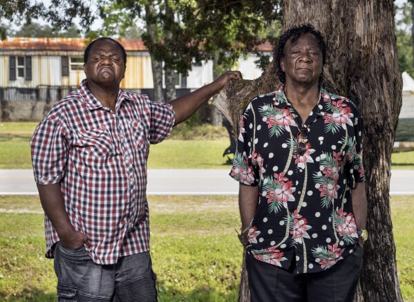 This image released by Amazon shows Licurtis Reels, left, and Melvin Davis from the documentary, “Silver Dollar Road." (Wayne Lawrence/Amazon via AP)