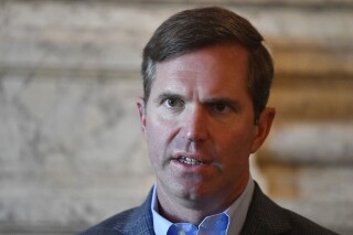 FILE - Kentucky Governor Andy Beshear replies to a question during his first interview following his re-election in the Kentucky Governors race in the State Reception Room at the Kentucky State Capitol Frankfort, Ky., Wednesday, Nov. 8, 2023. Beshear on Thursday, Nov. 16, announced the pending departure of the state's juvenile justice commissioner but said a series of policy actions within the past year had created a “good road map” for the troubled agency. (AP Photo/Timothy D. Easley, File)