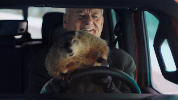 This undated image provided by Jeep shows Bill Murray reprises his role as Phil Connors from the 1993 film “Groundhog Day,” in a scene from the company's 2020 Super Bowl NFL football spot. (Jeep via AP)