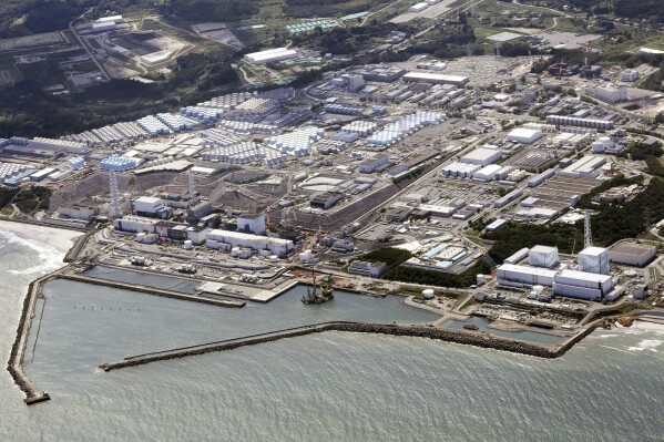 FILE - This aerial view shows the Fukushima Daiichi nuclear power plant in Fukushima, northern Japan, on Aug. 24, 2023, shortly after its operator Tokyo Electric Power Company Holdings TEPCO began releasing its first batch of treated radioactive water into the Pacific Ocean. The tsunami-damaged Fukushima Daiichi nuclear power plant began its third release of treated and diluted radioactive wastewater into the sea Thursday, Nov. 2, 2023 after Japanese officials said the two earlier releases ended smoothly. (Kyodo News via AP, File)