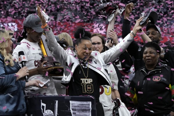 South Carolina head coach Dawn Staley celebrates after the Final Four college basketball championship game against Iowa in the women's NCAA Tournament, Sunday, April 7, 2024, in Cleveland. South Carolina won 87-75. (AP Photo/Morry Gash)
