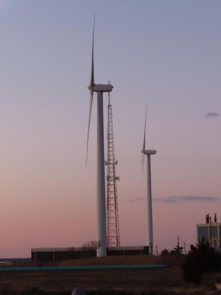 This Feb. 10, 2022, photo shows land-based wind energy turbines in Atlantic City, N.J. Offshore wind energy projects in many places in the U.S. are facing local opposition from those who fear possible environmental, economic and aesthetic impacts from placing turbines at sea. (AP Photo/Wayne Parry)