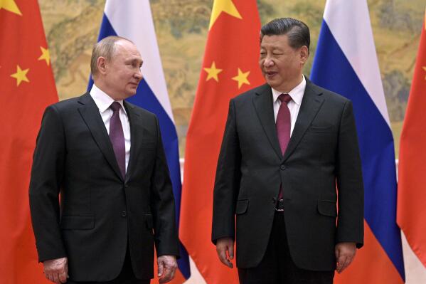 FILE - Chinese President Xi Jinping, right, and Russian President Vladimir Putin talk to each other during their meeting in Beijing on Feb. 4, 2022. Putin and Xi will meet next week at a summit in Uzbekistan, a Russian official said Wednesday, Sept. 7. (Alexei Druzhinin, Sputnik, Kremlin Pool Photo via AP, File)