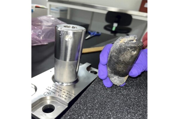This undated photo provided by NASA shows a recovered chunk of space junk from equipment discarded at the International Space Station. The cylindrical object that tore through a home in Naples, Fla., March 8, 2024, was subsequently taken to the Kennedy Space Center in Cape Canaveral, Fla., for analysis. (NASA via AP)