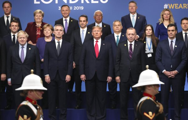 In this Dec. 4, 2019, photo, from front row left, British Prime Minister Boris Johnson, NATO Secretary General Jens Stoltenberg, U.S. President Donald Trump, Turkish President Recep Tayyip Erdogan and Spanish Prime Minister Pedro Sanchez attend a ceremony event during a NATO leaders meeting at The Grove hotel and resort in Watford, Hertfordshire, England. Three years into the Trump presidency, America’s new place in the world is coming into focus, with influence waning from NATO meeting rooms to the Middle East to the capital cities of key allies. And in many ways, that’s just fine with the White House.(AP Photo/Francisco Seco)