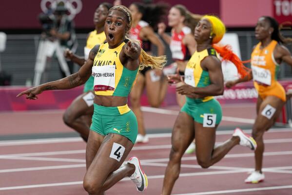 Elaine Thompson-Herah of Jamaica, celebrates as she wins the women's 100-meters final at the 2020 Summer Olympics, Saturday, July 31, 2021, in Tokyo. (AP Photo/David J. Phillip)