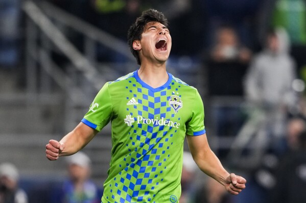 Seattle Sounders midfielder Josh Atencio reacts after his shot on goal against FC Dallas missed during the first half of an MLS playoff soccer match Monday, Oct. 30, 2023, in Seattle. (AP Photo/Lindsey Wasson)