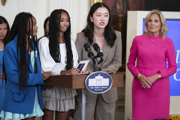 Mona Cho, of Redondo Beach, Calif., speaks during a 