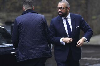 Britain's Home Secretary James Cleverly arrives for a Cabinet meeting in London, England, Tuesday, Dec. 19, 2023. (James Manning/PA via AP)