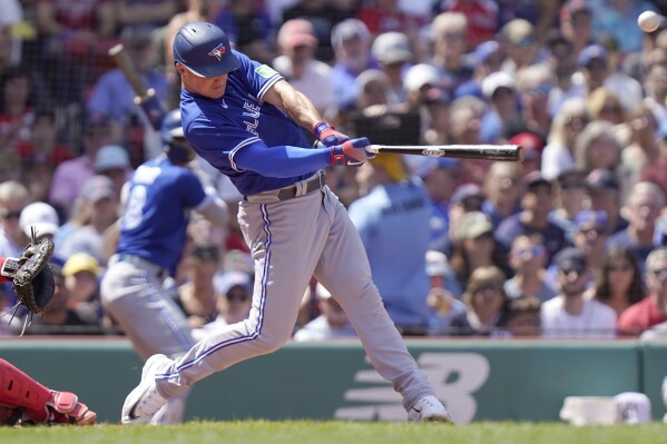 Schneider, Chapman lead the Blue Jays past Red Sox 13-1