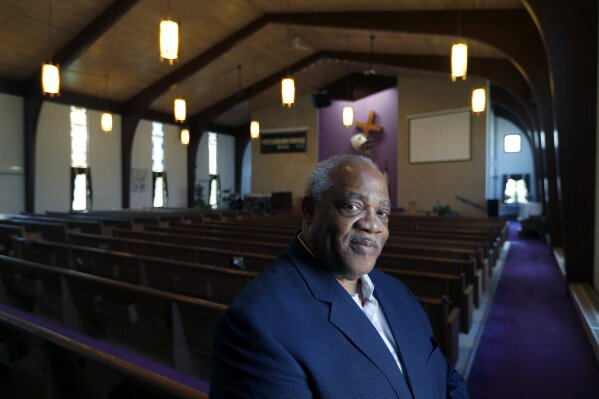 Pastor Hurley J. Coleman Jr., poses for a portrait Monday, June 29, 2020, inside the sanctuary of the World Outreach Campus Church in Saginaw, Mich. He says recent protests were the first time he's seen Blacks and whites march together in Saginaw favor of racial equality. “This is one of those terrible growth moments where people of goodwill and good thought can bring us to another level. ... When you build on truth, anything is possible.” (AP Photo/Charles Rex Arbogast)