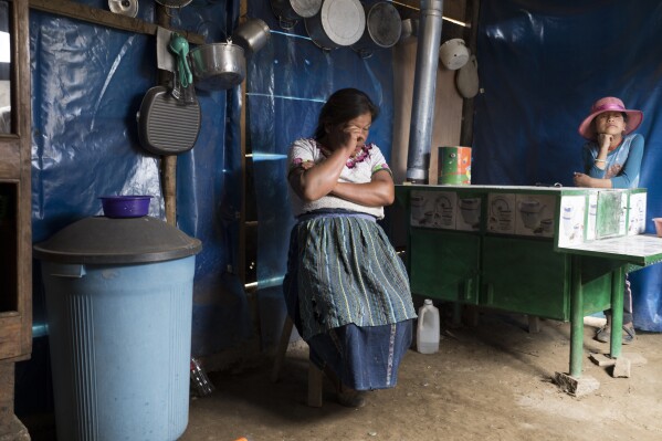 Reina Coronado gives an interview about her daughter Aracely who died trying to migrate to the U.S. in her one-room home near Comitancillo, Guatemala, Tuesday, March 19, 2024. Her 21-year-old daughter died alongside 50 other migrants, asphyxiated in a smuggler's trailer truck in San Antonio, Texas in June 2022. The last thing Aracely told her was that she’d go only for four years and send money to build a kitchen. (AP Photo/Moises Castillo)