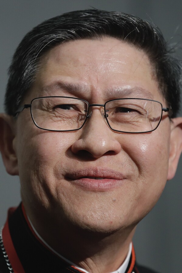 Cardinal Luis Antonio Tagle smiles during a news conference at the Vatican on Oct. 23, 2018. (AP Photo/Alessandra Tarantino, File)