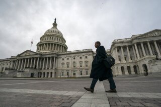
              The Capitol is seen as the partial government shutdown lurches into a third week with President Donald Trump standing firm in his border wall funding demands, in Washington, Monday, Jan. 7, 2019. After no weekend breakthrough to end a prolonged shutdown, newly empowered House Democrats are planning to step up pressure on Trump and Republican lawmakers to reopen the government. (AP Photo/J. Scott Applewhite)
            