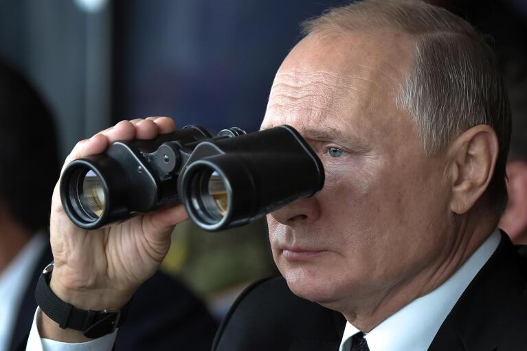 Russian President Vladimir Putin holds binoculars while watching military exercises Center-2019 at Donguz shooting range near Orenburg, Russia, on Sept. 20, 2019. Putin, whose forces invaded Ukraine on Feb. 24, 2022, appears determined to prevail -- ruthlessly and at all costs. (Alexei Nikolsky, Sputnik, Kremlin Pool Photo via AP, File)