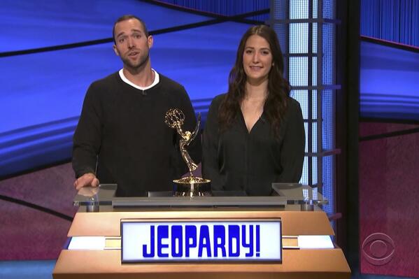 In this video image provided by NATAS and the Daytime Emmys, Matt Trebek, left, and Emily Trebek, children of the late Alex Trebek, accept the award for outstanding game show host for "Jeopardy!" on his behalf during the 48th Daytime Emmy Awards on Friday, June 25, 2021. (NATAS/Daytime Emmys via AP)