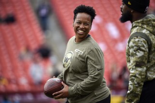 FILE -Washington Football Team assistant running backs coach Jennifer King works with the team before an NFL football game against the Tampa Bay Buccaneers, Sunday, Nov. 14, 2021, in Landover, Md. The Chicago Bears have hired Jennifer King as the first female assistant coach in franchise history working an assistant t working with running backs, Wednesday, Feb. 21, 2024. (AP Photo/Mark Tenally)