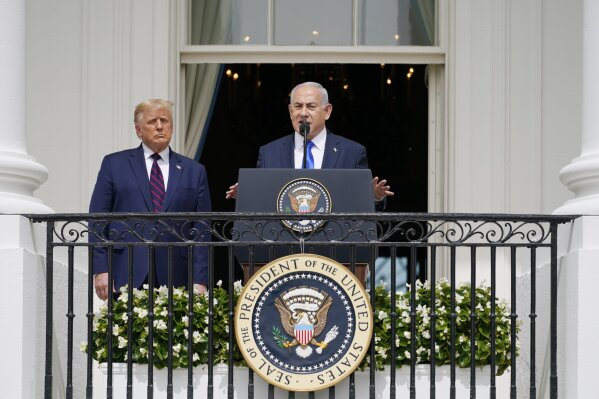 FILE - In this Sept. 15, 2020 file photo, Israeli Prime Minister Benjamin Netanyahu speaks as President Donald Trump looks on, during the Abraham Accords signing ceremony on the South Lawn of the White House, , in Washington. The world will be closely watching the Nov. 3 U.S. election. A number of prominent world leaders have a personal stake in the outcome of the race, with their fortunes depending heavily on the success – or failure – of President Donald Trump. Perhaps none has so much riding on a Trump victory as Israel’s prime minister, Benjamin Netanyahu. (AP Photo/Alex Brandon, File)