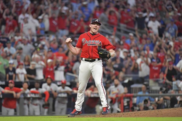 Atlanta Braves relief pitcher Mark Melancon reacts after he struck out St. Louis Cardinal' Kolten Wong to end Game 2 of a baseball National League Division Series on Friday, Oct. 4, 2019, in Atlanta. The Braves won 3-0. (Hyosub ShinAtlanta Journal-Constitution via AP)