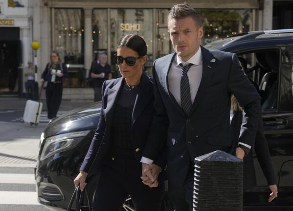 FILE - Leicester City and England soccer player Jamie Vardy, and his wife Rebekah Vardy, arrive together at the High Court in London, Tuesday, May 17, 2022. On Friday, July 29, 2022, Judge Karen Steyn has cleared Coleen Rooney of libeling Vardy when she alleged that Vardy had leaked her private social media posts to the tabloid press. (AP Photo/Alastair Grant, File)