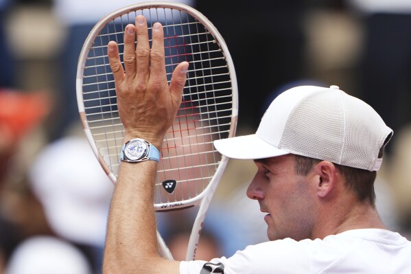 Tommy Paul of the U.S. reacts after beating Australia's Alexei Popyrin during their fourth round match of the French Tennis Open, at the Roland-Garros stadium, in Paris, Sunday, June 1 2025. (AP Photo/Lindsey Wasson)