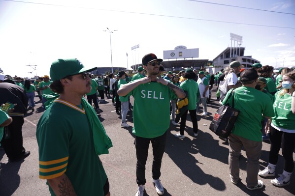 A's investigating why 'SELL' T-shirt fans were removed from suites