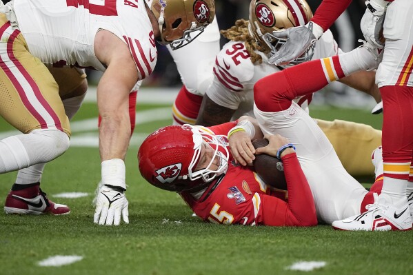 Kansas City Chiefs quarterback Patrick Mahomes (15) is sacked during the first half of the NFL Super Bowl 58 football game against the San Francisco 49ers, Sunday, Feb. 11, 2024, in Las Vegas. (AP Photo/Brynn Anderson)