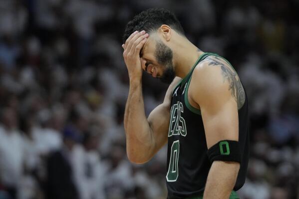 Boston Celtics forward Jayson Tatum (0) reacts during the second half of Game 3 of the NBA basketball playoffs Eastern Conference finals against the Miami Heat, Sunday, May 21, 2023, in Miami. (AP Photo/Wilfredo Lee)