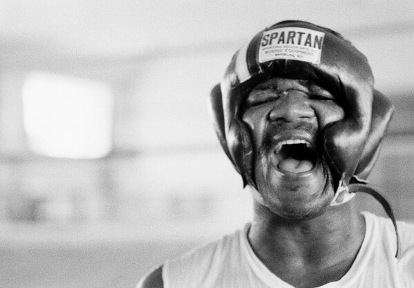 George Foreman yells, Oct. 15, 1974, in N'Sele, Kinshasa, Zaire. (AP Photo/Horst Faas, File)