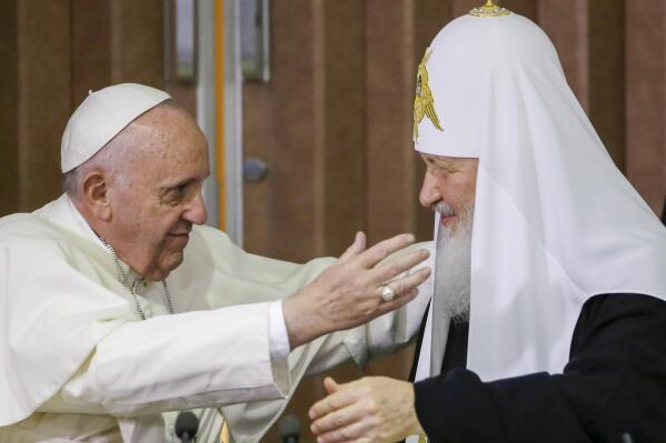 FILE — Pope Francis, left, reaches to embrace Russian Orthodox Patriarch Kirill after signing a joint declaration at the Jose Marti International airport in Havana, Cuba o Feb. 12, 2016. The Vatican said Tuesday, May 31, 2022 that Pope Francis will travel to Kazakhstan in September for an interfaith conference, a meeting that may give him a chance to meet with the head of the Russian Orthodox Church. The meeting with Patriarch Kirill would be significant given his justification for Russia’s war in Ukraine. Francis called off a planned encounter with Kirill in June in Jerusalem because of the diplomatic fallout it might create. (AP Photo/Gregorio Borgia, Pool)