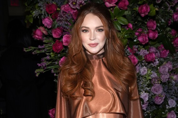 FILE - Lindsay Lohan appears the Christian Siriano Fall/Winter 2023 fashion show in New York, Feb. 9, 2023. Lohan has given birth to a boy, her first child. The “Parent Trap” star and her husband, financier Bader Shammas, are the parents of a “beautiful, healthy son” named Luai, the rep told The Associated Press in a statement Monday, July 17. (Photo by Charles Sykes/Invision/AP, File)