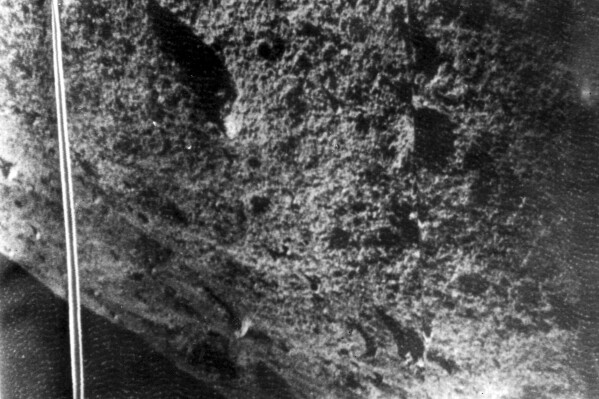 FILE- Picture shows the moon's surface taken by the Russian moonprobe Luna 9, Feb. 4, 1966. The pictures for the first time enable scientists to analyze the microstructure of the moon's surface. The picture was released by the radio telescope at Jodrell Bank Observatory in Cheshire, England, which picked up Luna 9's signals. (AP Photo/File)