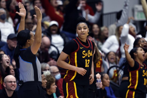 Southern California guard JuJu Watkins (12) reacts after making a 3-point basket in the second half of an NCAA college basketball game against Stanford, Friday, Feb. 2, 2024, in Stanford, Calif. (AP Photo/Josie Lepe)