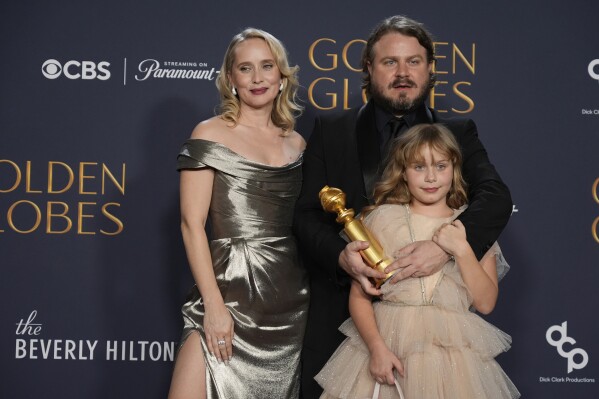 Mona Fastvold, from left, Ada Corbet, and Brady Corbet, winner of the award for best director - motion picture for "The Brutalist", pose in the press room during the 82nd Golden Globes on Sunday, Jan. 5, 2025, at the Beverly Hilton in Beverly Hills, Calif. (AP Photo/Chris Pizzello)