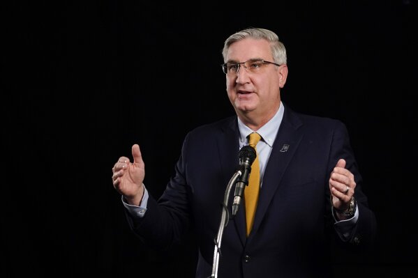 Indiana Republican Gov. Eric Holcomb participates in the Indiana Gubernatorial debate with Democrat Woody Myers and Libertarian Donald Rainwater, Tuesday, Oct. 27, 2020, in Indianapolis. The candid...