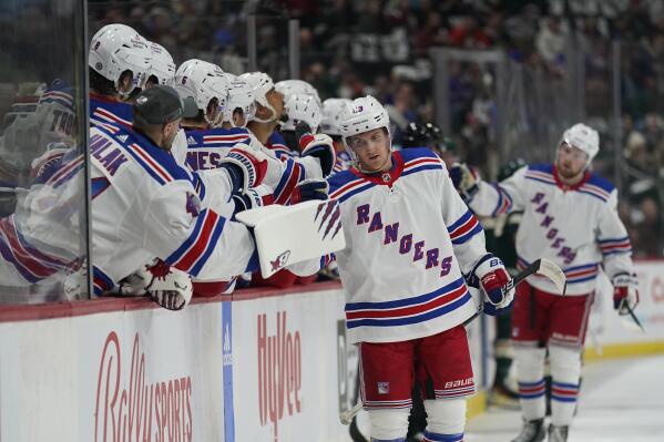 New York Rangers defenseman Adam Fox (23) celebrates after scoring a goal during the first period of the team's NHL hockey game against the Minnesota Wild, Thursday, Oct. 13, 2022, in St. Paul, Minn. (AP Photo/Abbie Parr)