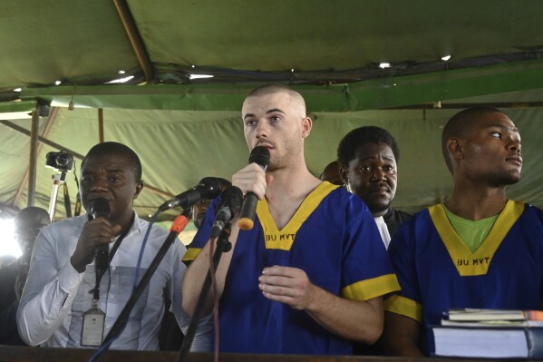 Tyler Thompson Jr, addresses the court in Kinshasa with 52 other defendants Friday June 7, 2024, accused of a role in last month's attempted coup in Congo, led by little-known opposition figure Christian Malanga, in which six people were killed. (AP Photo/Samy Ntumba Shambuyi, file)