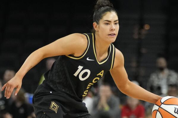 FILE - Las Vegas Aces' Kelsey Plum drives against the Dallas Wings during the second half of a WNBA basketball game June 5, 2022, in Las Vegas. Plum has been elected to serve as first vice president of the WNBA Players Association. It is her first term on the WNBPA Executive Committee. (AP Photo/John Locher, File)