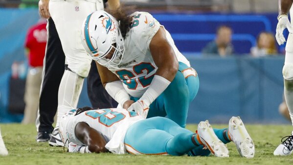 Daewood Davis of Dolphins carted off field after collision; preseason game  vs. Jaguars halted
