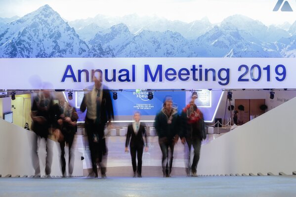 
              People walk up stairs at the congress center where the annual meeting of the World Economic Forum 2019, WEF, take place in Davos, Sunday, Jan. 20, 2019. (AP Photo/Markus Schreiber)
            