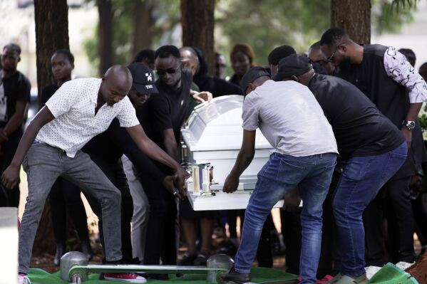 Mourners bury the body of Nigerian Ladi Anzaki Olubunmi, a TikTok content moderator employed by subcontractor Teleperformance, at the Langata cemetery in Nairobi, Kenya Thursday, April. 17, 2025. (AP Photo/Brian Inganga)
