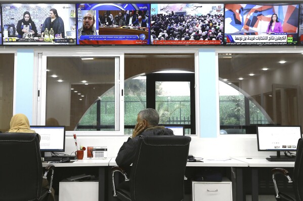 Journalists work at a private television broadcaster in Algiers, Tuesday, March 19, 2024. Algerian officials are chiding television stations over the content choices they've made during Ramadan. Their criticisms come amid broader struggles facing journalists and broadcasters, which have historically relied heavily on advertising from the state and Sonatrach, its largest oil and gas company. (AP Photo/Anis Belghoul)