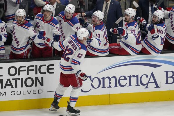 New York Rangers right wing Julien Gauthier (12) is congratulated after scoring against the San Jose Sharks during the third period of an NHL hockey game in San Jose, Calif., Saturday, Nov. 19, 2022. (AP Photo/Jeff Chiu)