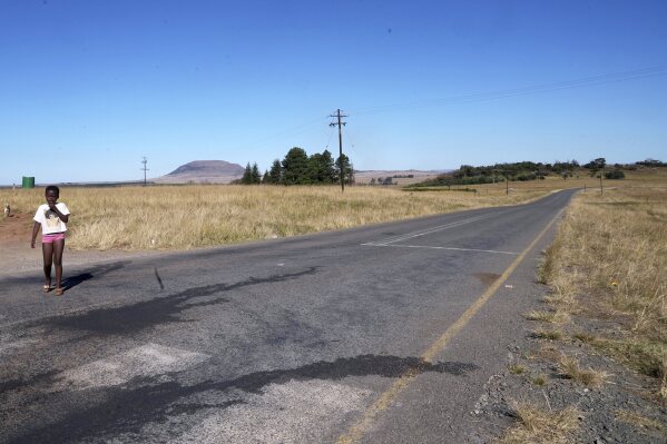A young girl walks in Normandien, a rural area in KwaZulu-Natal province, South Africa, May 23, 2025. (AP Photo/Alfonso Nqunjana)