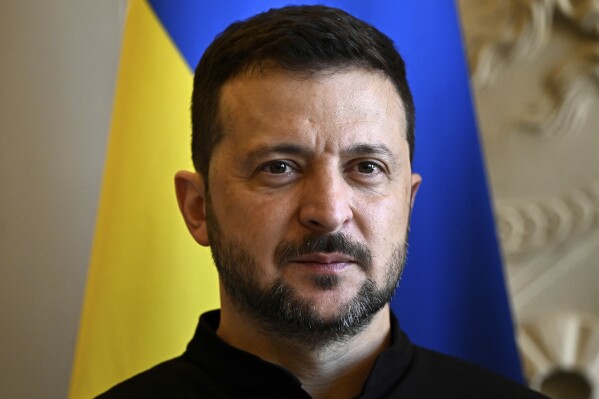 FILE - Ukrainian President Volodymyr Zelenskyy poses at the French National Assembly before his address to lawmakers, Friday, June 7, 2024 in Paris. Switzerland’s president says 90 countries and organizations, half from Europe, have registered to take part in a Ukraine peace summit on June 15 and 16, 2024. (Julien de Rosa/Pool via AP, File)