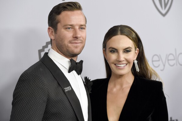 FILE - Armie Hammer, left, and wife Elizabeth Chambers arrive at the InStyle and Warner Bros. Golden Globes afterparty, Jan. 7, 2018, in Beverly Hills, Calif. Hammer has reached a divorce agreement with Chambers, nearly three years after she filed to end their marriage. Hammer's attorney filed documents in Los Angeles Superior Court on Tuesday, June 20, 2023, informing a judge that the actor and Chambers have come to terms over child custody, child support, spousal support and division of assets. (Photo by Chris Pizzello/Invision/AP, File)
